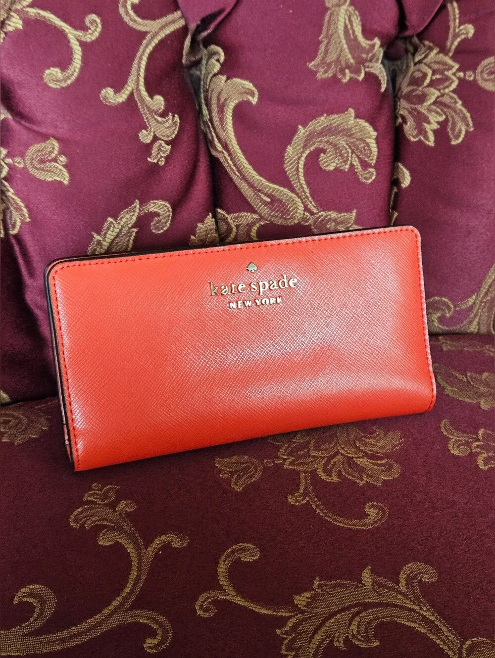 Kate Spade New York coral orange Saffiano leather continental wallet